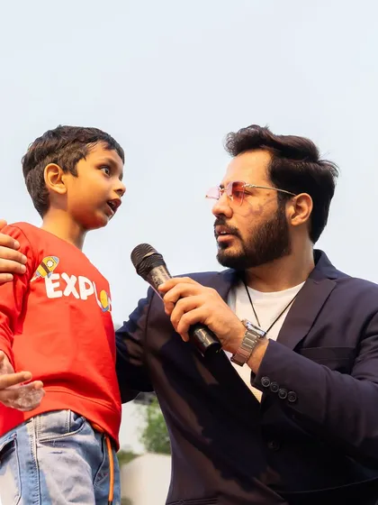 Hosting isn't just for big crowds. Some of the best moments come from connecting one on one, like at this kids' carnival. Making even the youngest guests feel seen and heard is what it's all about.