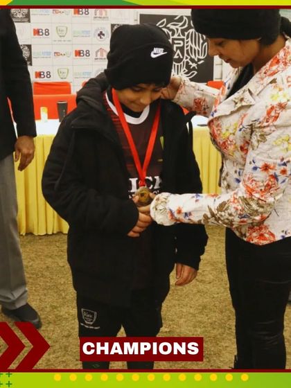 A player receives her medal, a reward for her hard work and dedication throughout the season.