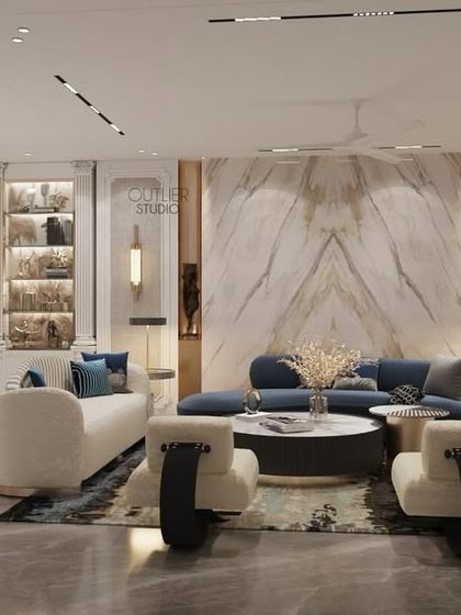 Where memories are made. This open-plan living and dining area features a stunning arched bar cabinet, a book-matched marble wall, and a mix of white and blue furniture for a fresh, contemporary look.