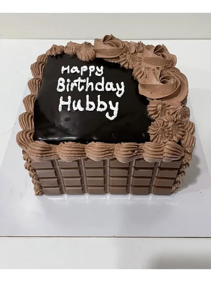 Another version of the square chocolate cake, this time with Cadbury chocolate bars lining the sides for an extra chocolatey crunch.