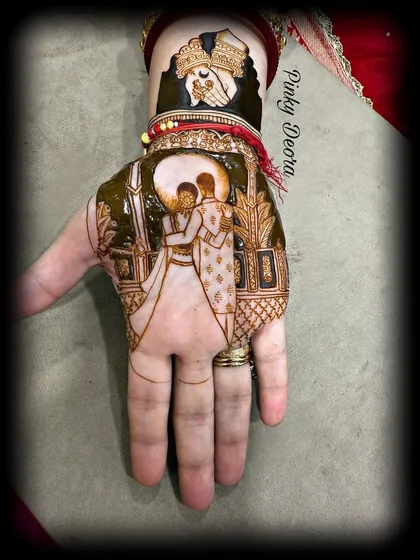 The final look of the Karwa Chauth design, with the couple's portrait, the moon, and the traditional sieve. It's a complete story on one hand.