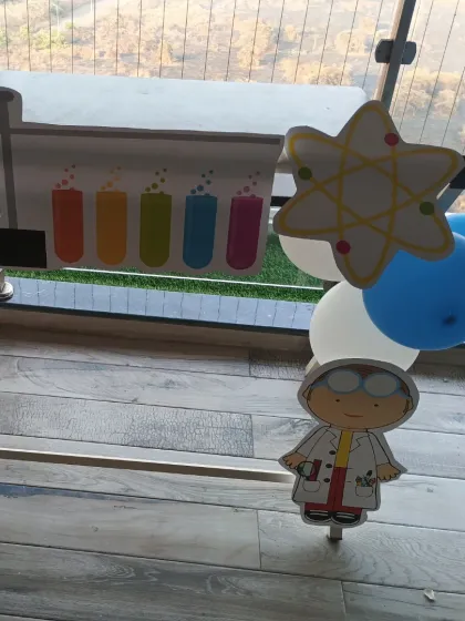 Detail shot of the custom scientist and experiment-themed cutouts we provide.