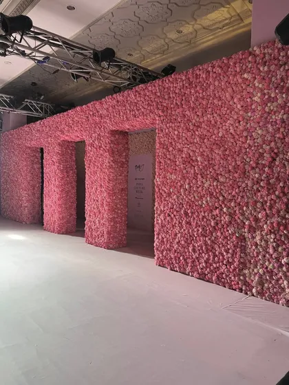 The clean, powerful lines of the floral architecture for Dolly J's show. The design combined soft textures with strong, geometric forms to create a modern yet romantic runway.