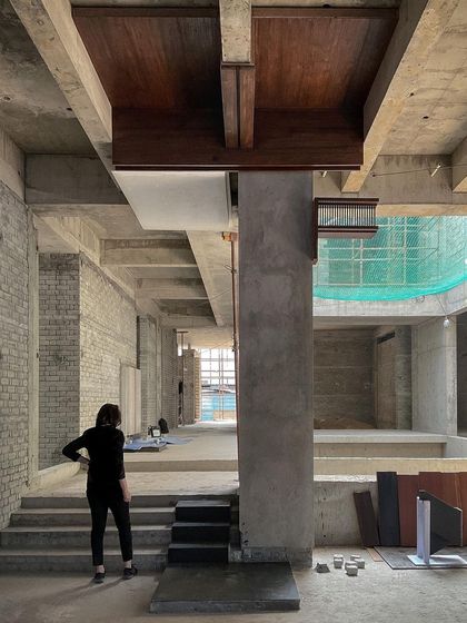 Reviewing the first mock-ups for a custom wood-clad element at our Hyderabad courtyard house site. This early-stage review ensures the design intent is perfectly translated by our team of craftsmen.