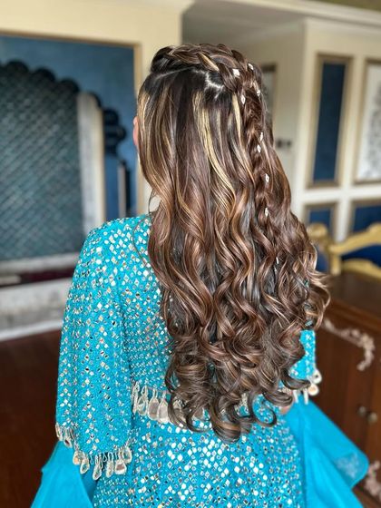 Another angle of the intricate braided half-up style.