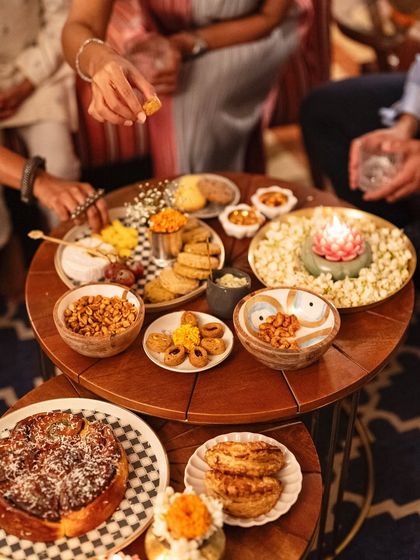 Another angle of our festive grazing setup, showcasing a mix of sweet and savory options like our pull-apart babka, gujiyas, and assorted nuts and cheeses.