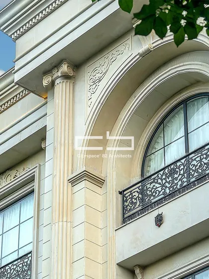A close-up of a facade embodying classical elegance. Ionic capitals, arched designs, and ornate mouldings accentuate the structure, infusing it with a sense of grandeur and timeless appeal.