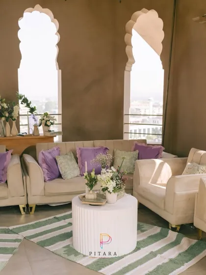 This lounge is giving main character energy. We set up this chic seating area with a stunning city view, using plush beige sofas, pops of lavender, and a modern striped rug to create a sophisticated yet relaxed vibe.