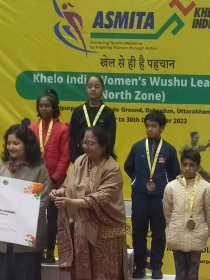The awards ceremony at the Khelo India Women's Wushu League. Seeing my students on the podium, recognized for their skill and hard work, is the ultimate goal of my coaching.