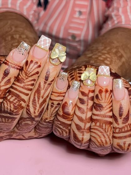 A unique bridal set with square-tip extensions, featuring a subtle glitter ombre, a classic quilt pattern, and charming 3D butterfly accents.