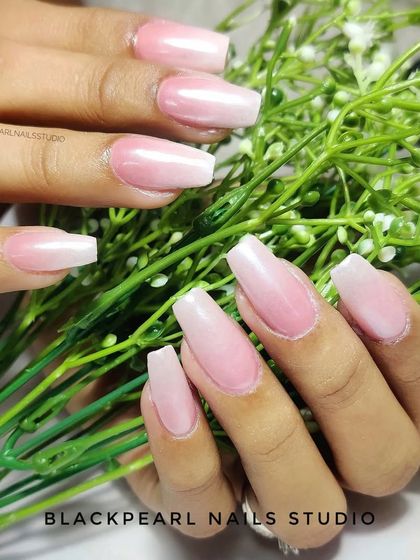 A beautiful example of the baby boomer effect on long, coffin-shaped nails, showing the seamless French fade from pink to white.