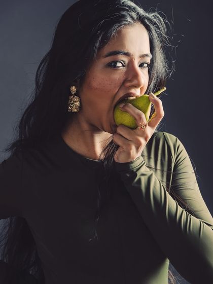 A provocative and playful shot from a creative portrait series. Using props in unexpected ways helps to build a unique narrative.