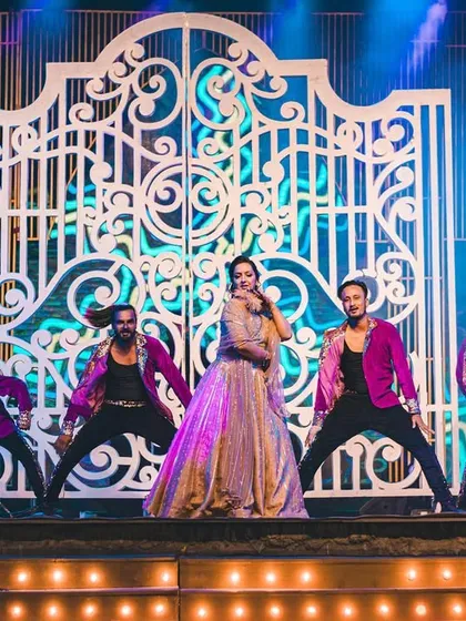 The bride takes center stage for her solo performance, backed by our team of professional dancers who add energy and scale to the act.