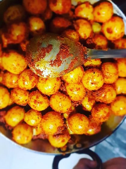 A spoonful of the Amla Pickle masala being mixed. I roast all my spices myself to bring out their maximum aroma and taste.