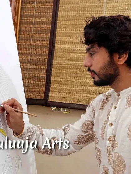 A close-up of me painting a Krishna pichwai, a traditional style of devotional art. This form of painting requires immense focus and is a deep meditative practice for me.