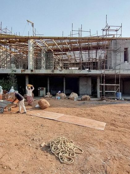 House K in Hyderabad begins to take shape. This photo shows the concrete and steel frame ready for its zinc roof and final finishing.