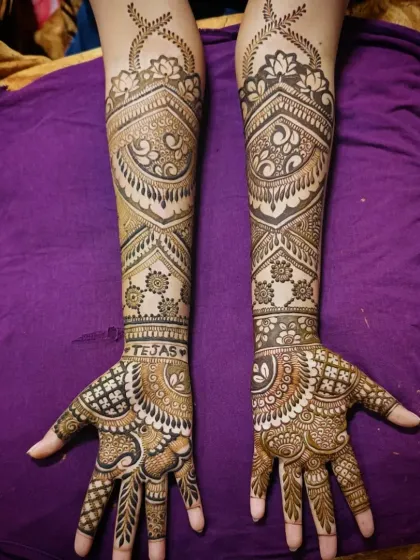 This is an example of my intricate full-arm mehandi work. The design features a mix of delicate paisleys, bold geometric bands, and fine line work, creating a stunning and balanced look perfect for any grand celebration.
