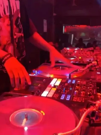 A shot of me working the decks during a hip hop and R&B night. The focus is on quick mixes and scratches to keep the party moving.