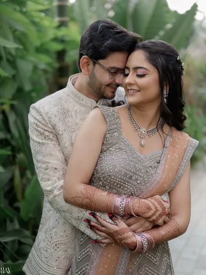 An intimate close-up that captures the deep connection between the couple. The groom's gentle embrace and their serene expressions make this a truly romantic and heartfelt photograph.