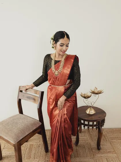 A duplicate of ID 30, this image shows a full-length view from a professional photoshoot. The soft, natural makeup allows the beautiful saree and the model's elegance to take center stage.