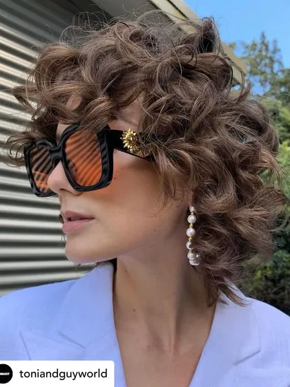 We are obsessed with these curls. This look showcases a beautifully shaped cut on naturally curly hair, defining the curls and creating amazing volume and texture. We love helping our clients embrace their natural hair.