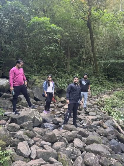 Navigating a rocky stream bed is part of the adventure on the Kumara Parvatha trek.