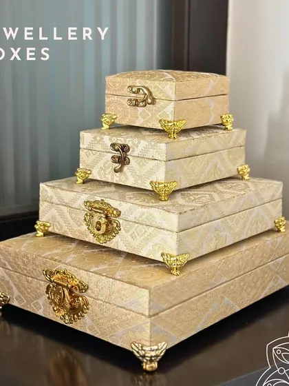 This set of four stacking jewelry boxes is one of my most popular trousseau items. Covered in a beautiful cream and gold brocade fabric with ornate clasps, they are perfect for organizing all your precious jewels.