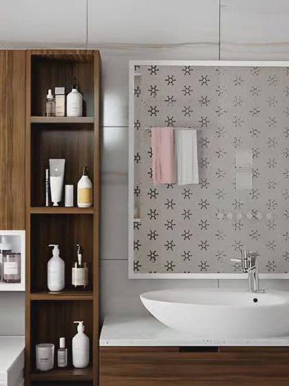 This design showcases excellent storage solutions in a bathroom. The mirror cabinet and open shelving next to the washing machine keep all toiletries neatly organized and accessible.
