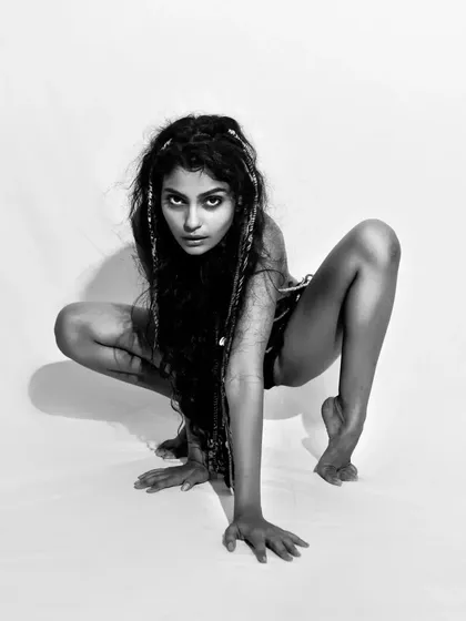 A primal, crouching pose that is full of energy and attitude. This is a great example of directing models to create unique and memorable shots.