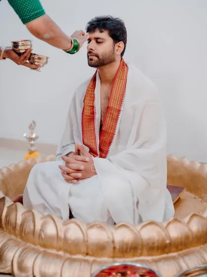 The groom's Haldi ceremony, featuring our custom-made golden lotus seat. We ensure that the decor is consistent and beautiful for both the bride and groom's events.