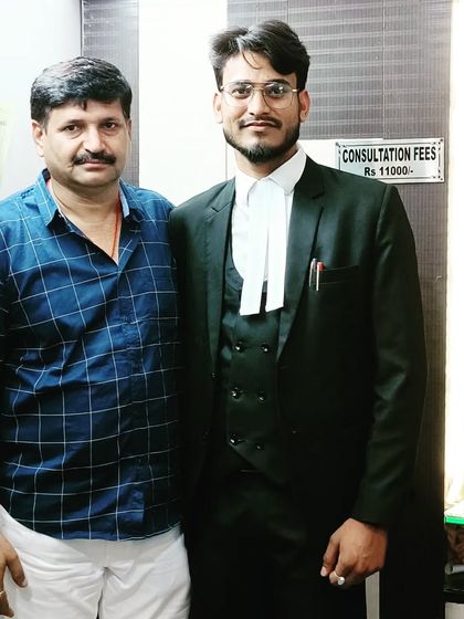 A proud moment with my father in my office. His support has been a constant source of strength.