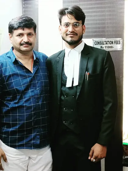 A proud moment with my father in my office. His support has been a constant source of strength.