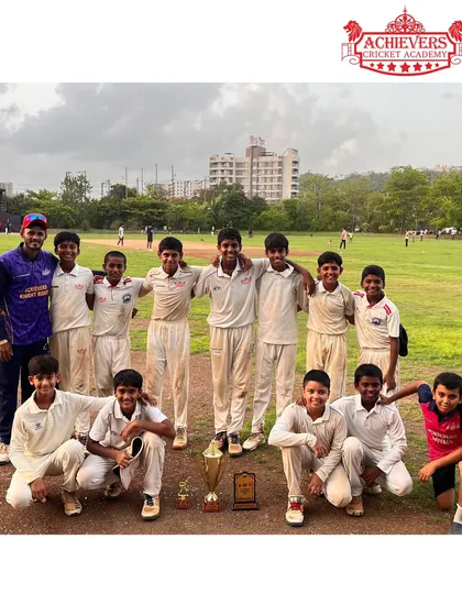 The U-14 team posing with the AT Cup trophy after a dominant performance in the tournament, showcasing their teamwork and skill.