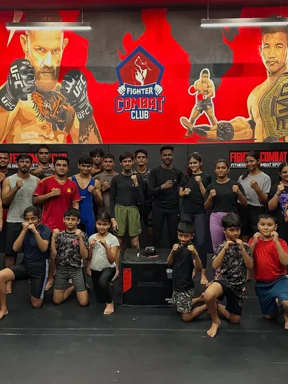 Champions Celebration! The whole team, kids and adults, posing together. We celebrate every victory, big or small, as a family.