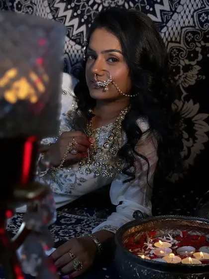 A captivating shot from our 'Heeramandi' recreation. The traditional nose ring and jewelry, paired with soft, expressive makeup, tell a story of timeless beauty.
