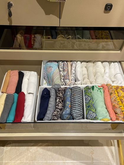 This drawer uses simple dividers to create neat rows of file-folded tops, making it easy to see patterns and colors.