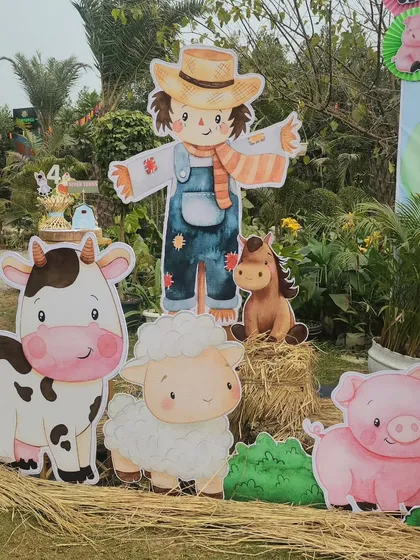 Another angle of the charming farm animal cutouts. The high-quality printing and sturdy construction ensure they look great in an outdoor setting.