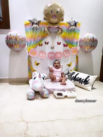 Six months of pure joy! I created this adorable half-birthday setup for little Rehanshi, complete with a rainbow backdrop, personalized cushion, and a cuddly unicorn. It’s the perfect way to celebrate being halfway to one.