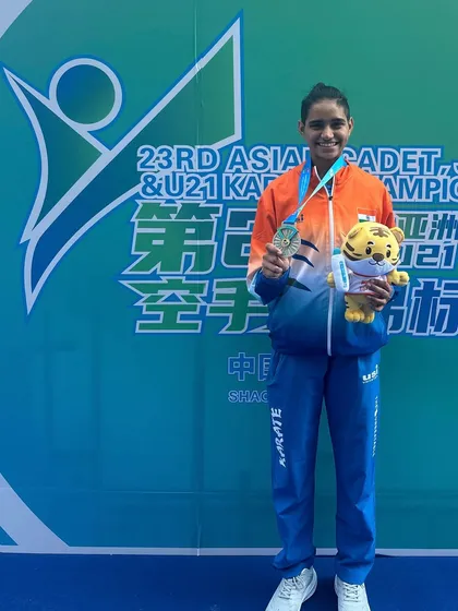 Ms. Rusha Tambat proudly displaying her silver medal. With such talent, I am confident that a gold medal for India is not far away.