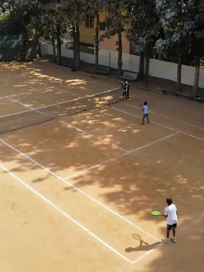 An overhead view of our facility showing multiple courts in use. This perspective showcases the ample space and active community you can join, whether for a casual weekend game or regular group play.