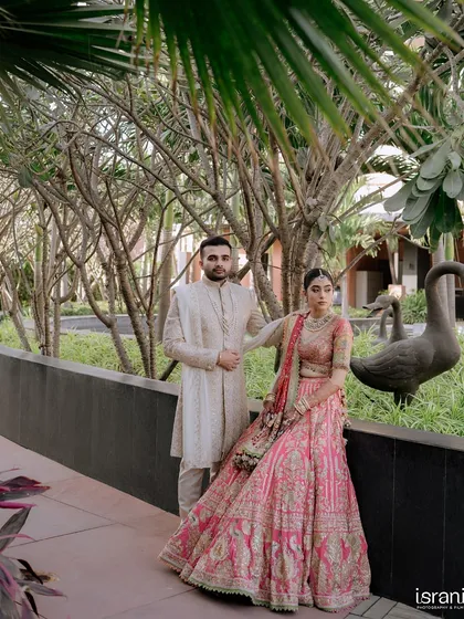 A stylish portrait of the couple at their destination wedding venue. We help scout the best locations for photos that are both beautiful and unique.
