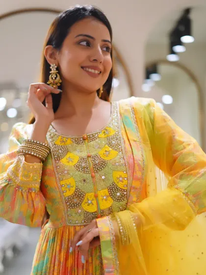 Not over how stunning this outfit is. The details on this yellow Anarkali are a dream.