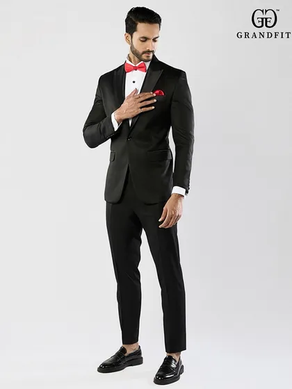 A full-length view showcasing the elegant proportions of our bespoke tuxedos. The trousers are tailored for a clean, modern line that complements the jacket perfectly.