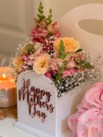 The floral component of the 'Bloom Box', a beautiful arrangement of fresh flowers with a "Happy Mother's Day" sign. This shows how I partner with florists to create a complete gifting experience.