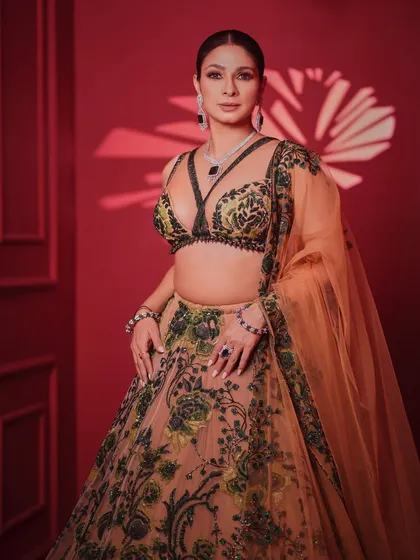 A full-length view of the intricately embroidered lehenga. The unique color combination and modern blouse design make this a standout piece for any grand occasion.
