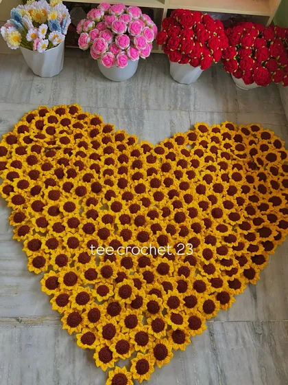 A giant heart made entirely of my crochet sunflower heads, a fun project after a big order.