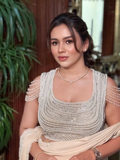 A direct portrait capturing a soft, confident expression.