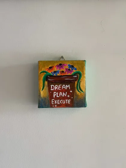 "Dream Plan Execute." This mini canvas painting, with its potted plant design, serves as a visual checklist for achieving your goals.