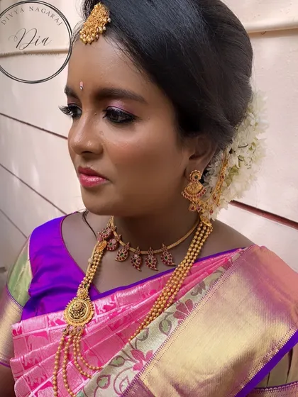 A beautiful portrait of my client at her baby shower. The entire look, from the makeup to the jewellery and hairstyle with fresh flowers, comes together to create a timeless and traditional feel.