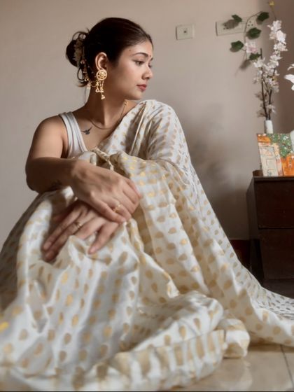 The quiet elegance of a white and gold saree. This is a classic combination that I styled for a soft, graceful look, perfect for a puja or a family gathering.
